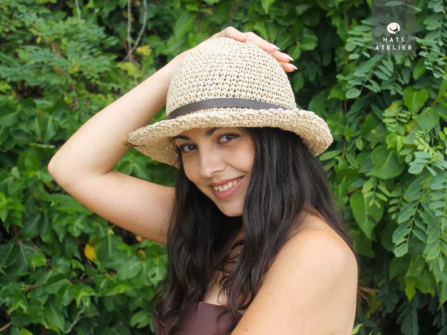 boho crochet raffia hat worn by woman front view