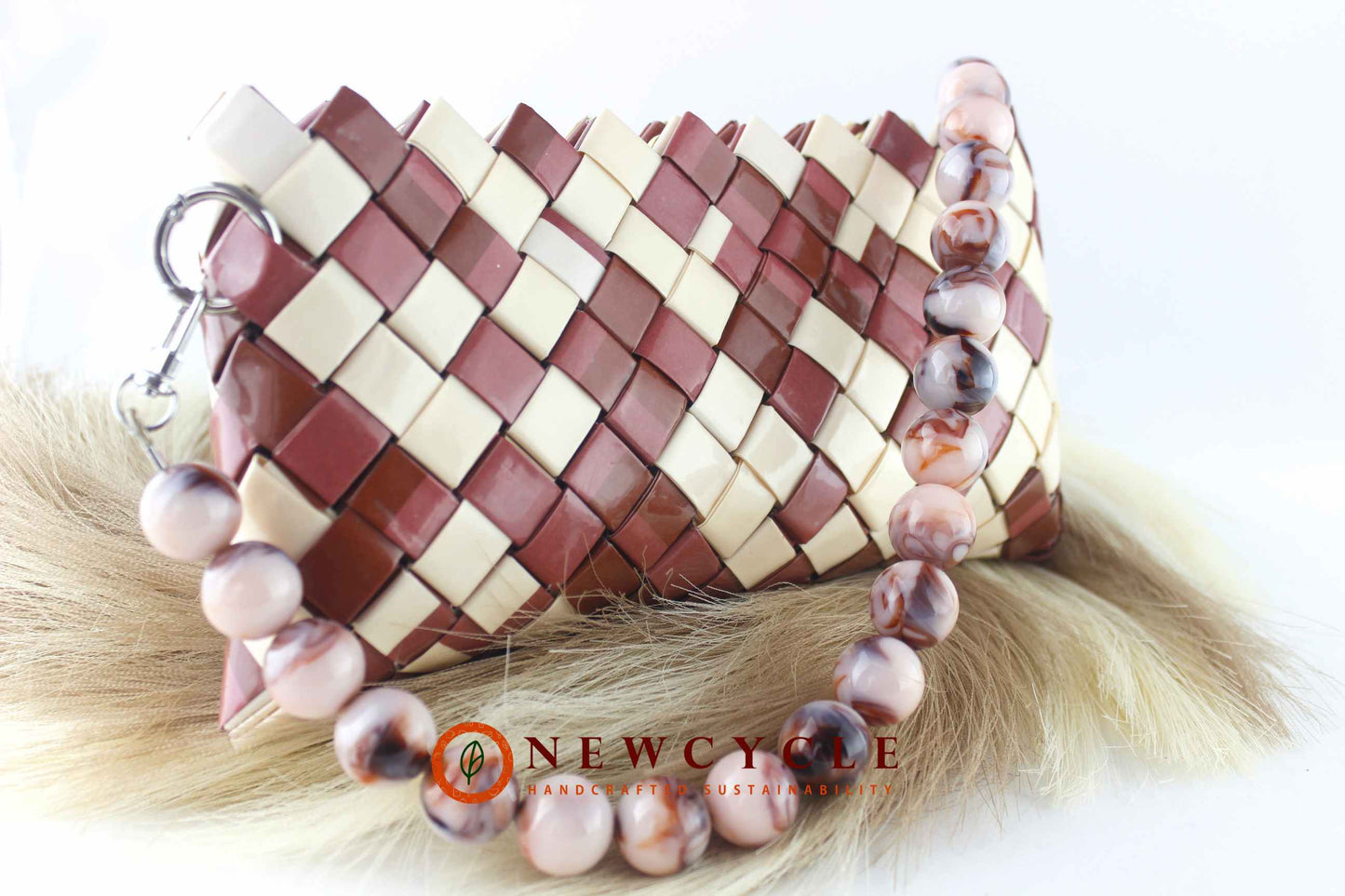 brown and cream handcrafted woven purse close-up