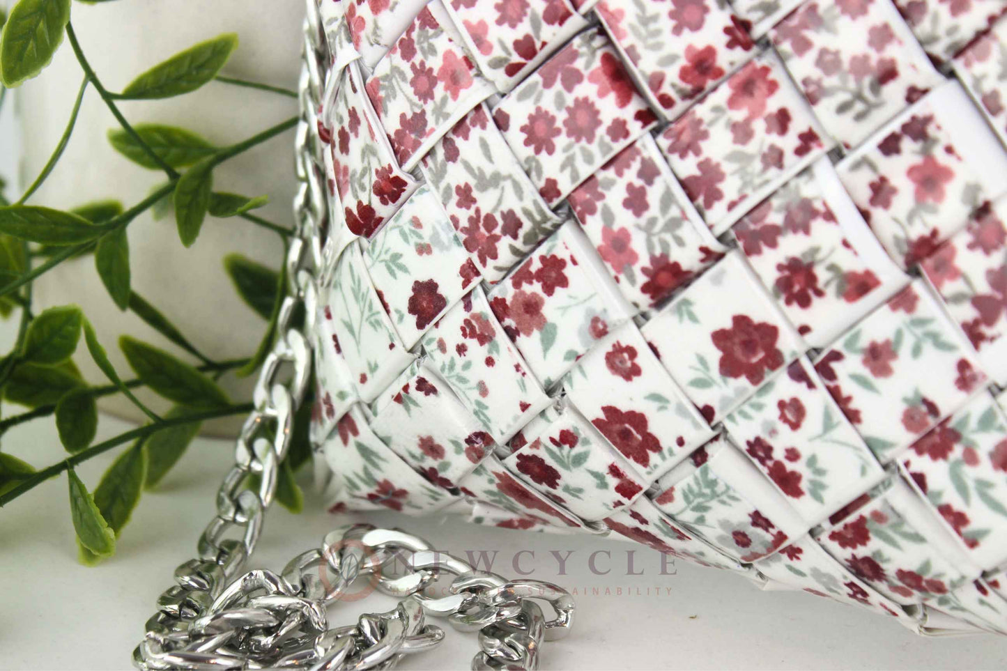 Close-up of red floral woven pattern on handmade purse