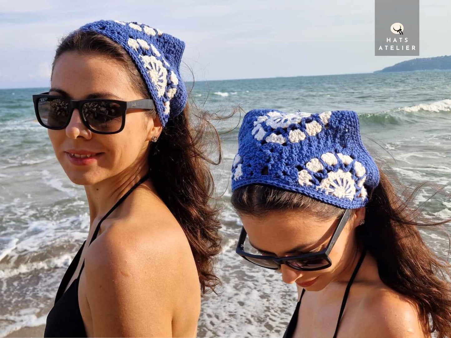 Two women wearing blue crochet hats with white patterns on a beach.
