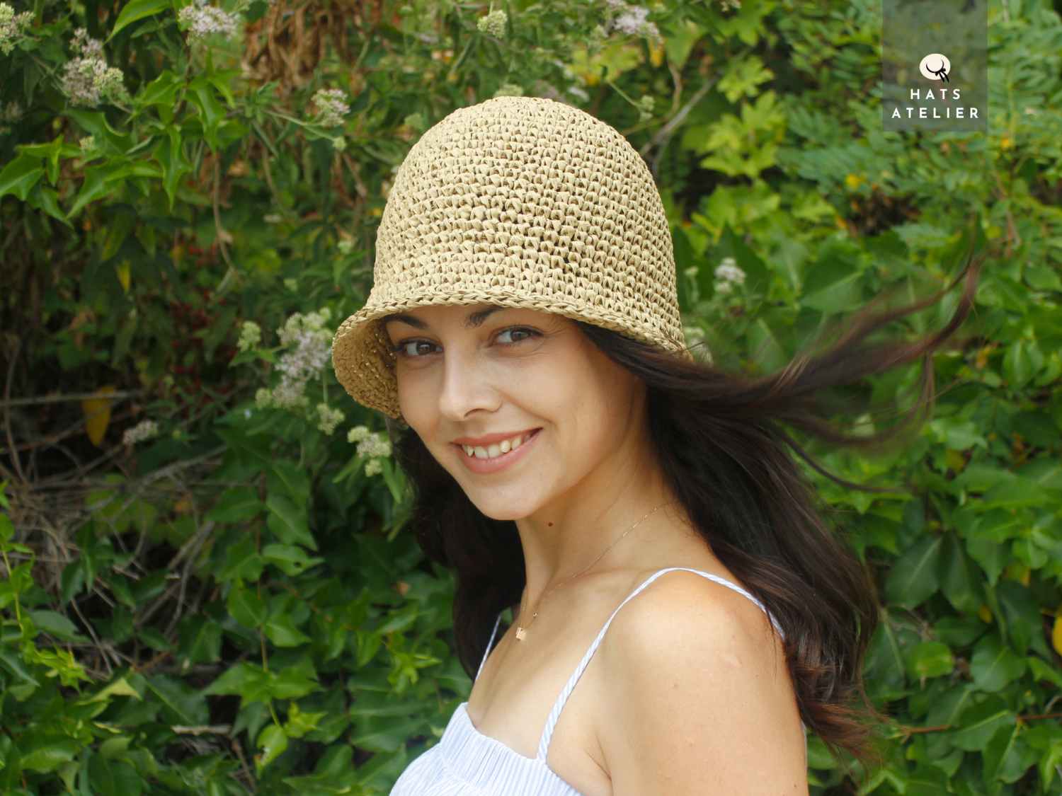 Crochet raffia bucket hat on model, natural straw boho style