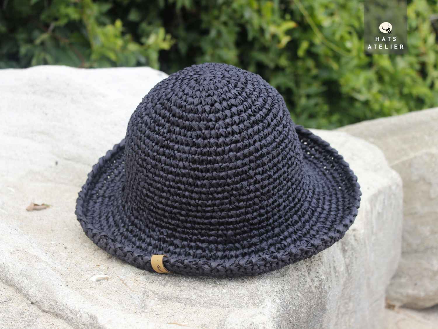 Handwoven black crochet raffia hat with medium brim