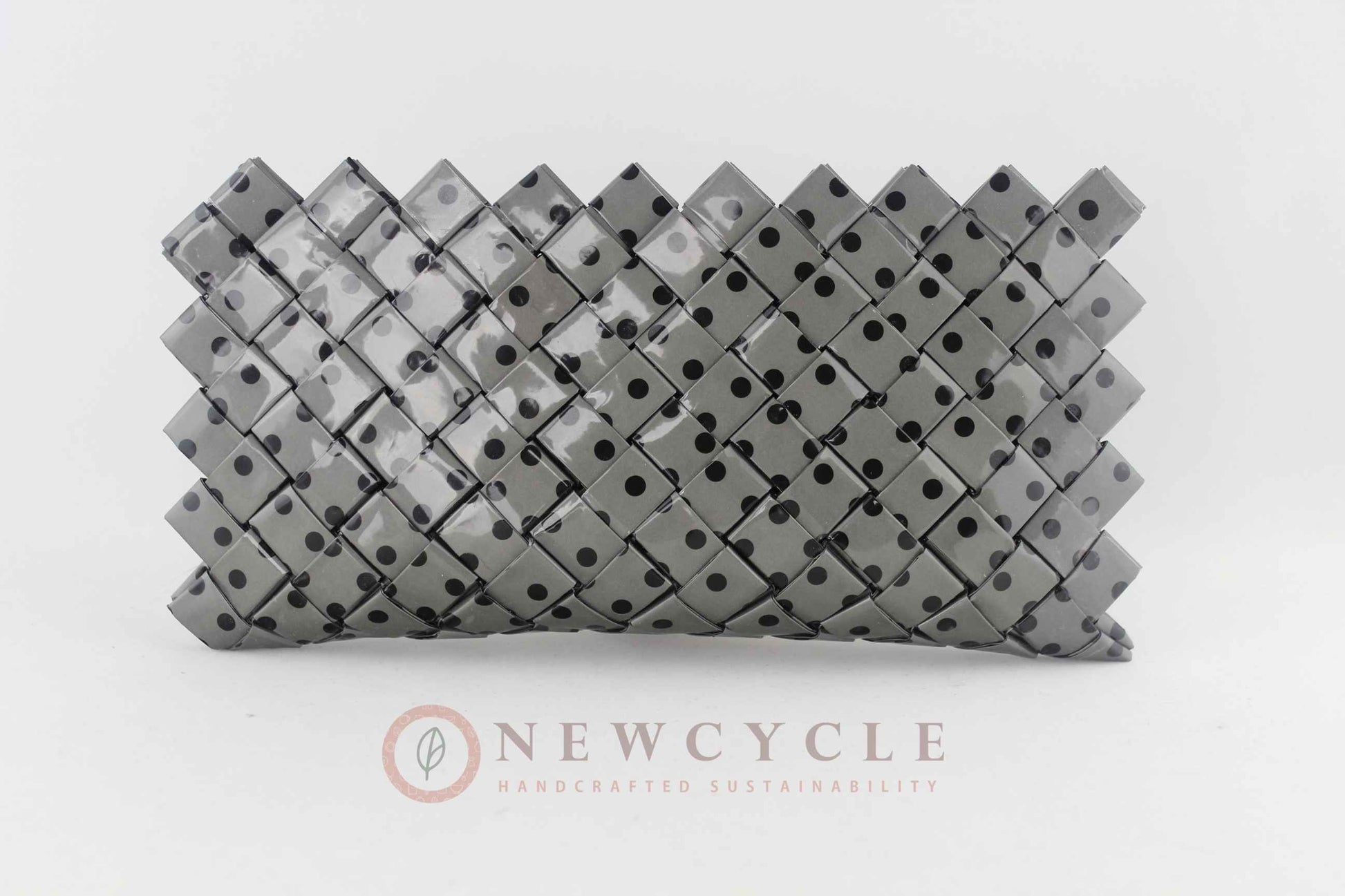 Front view of grey polka dot upcycled woven purse