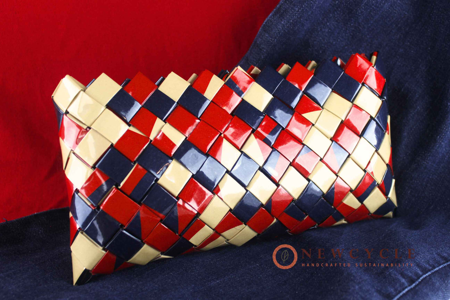 Close-up of red navy cream handmade woven clutch