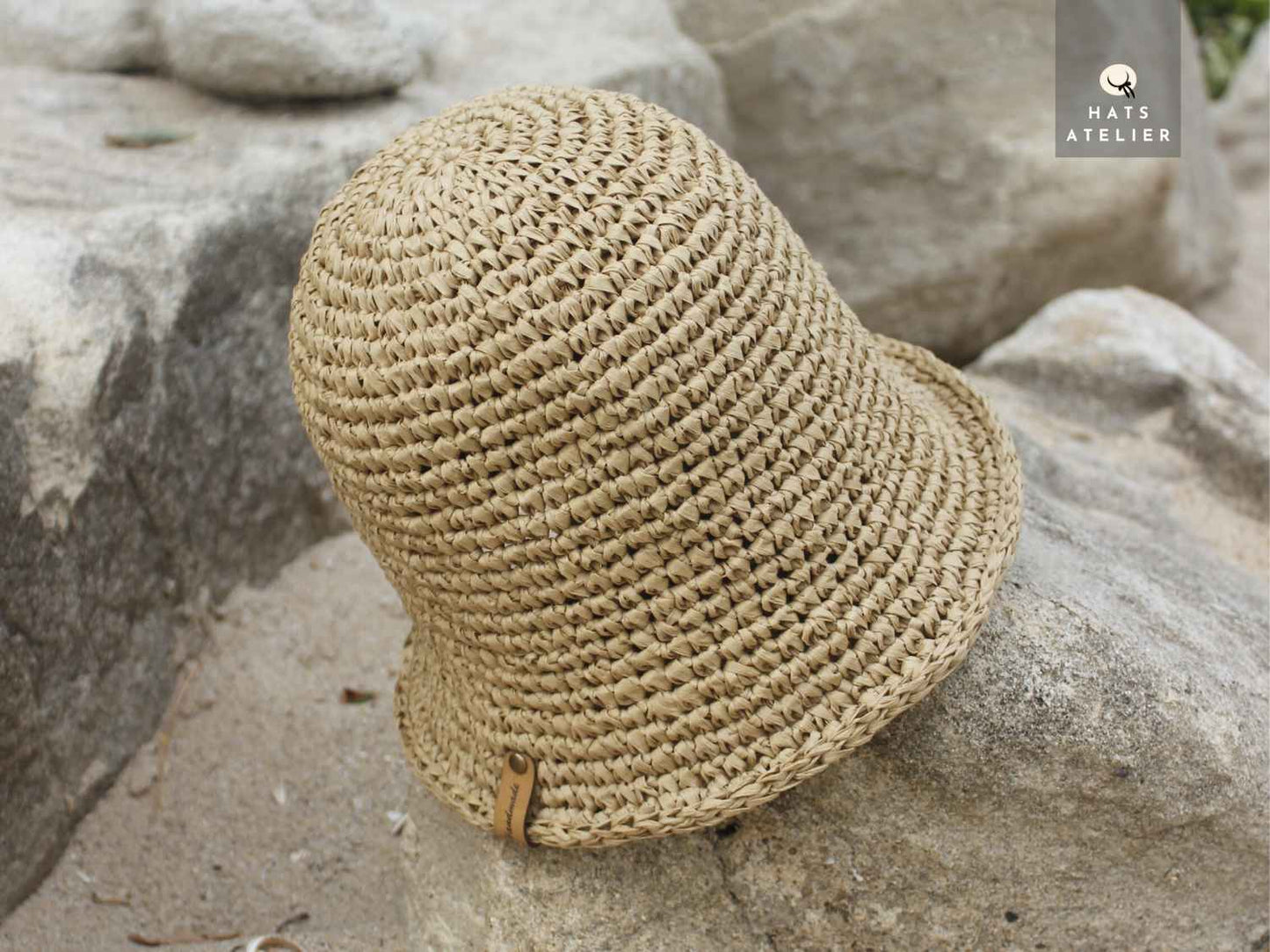 Close-up of natural raffia bucket hat with crochet texture