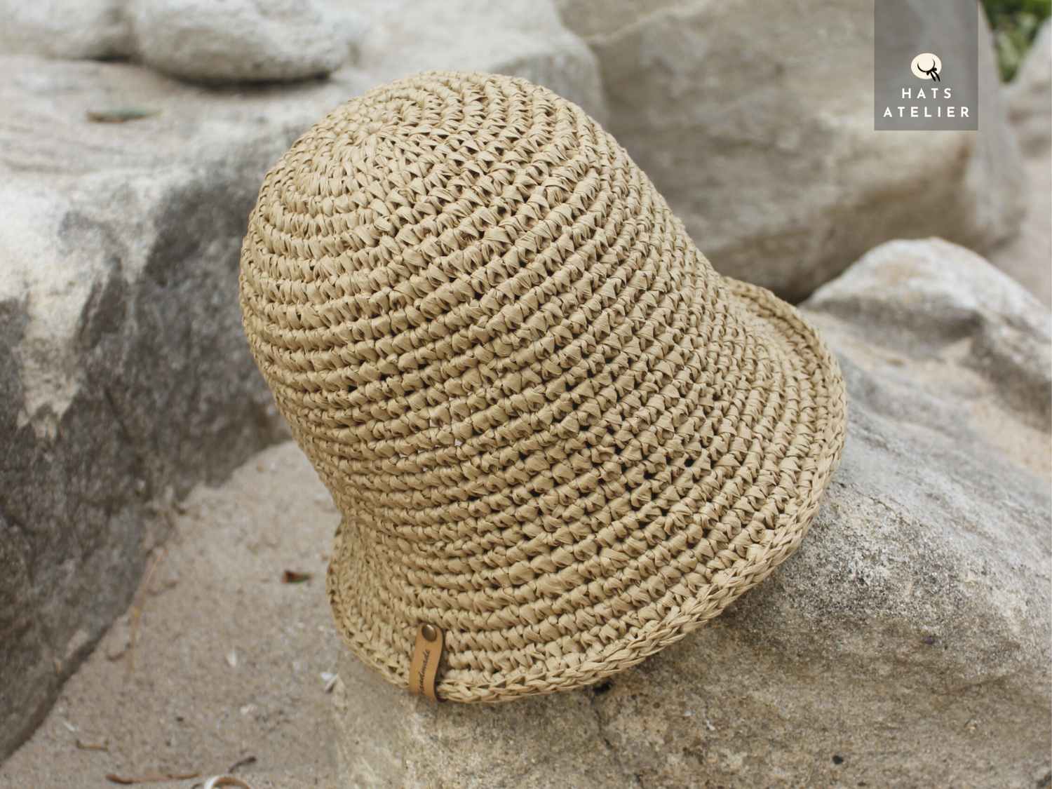 Close-up of natural raffia bucket hat with crochet texture