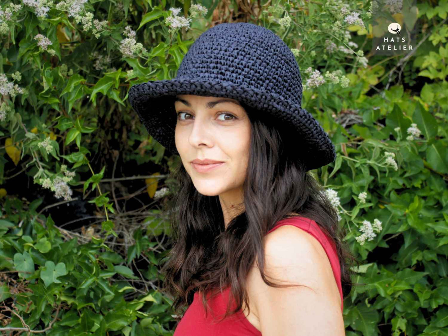 Handwoven black raffia hat with medium brim portrait view