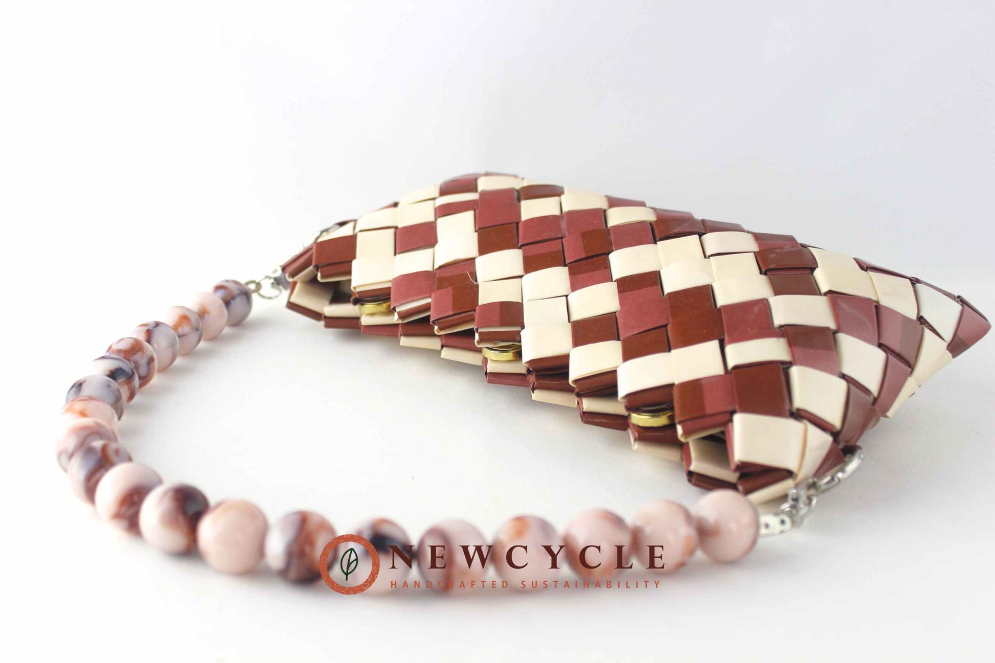 brown cream clutch with chunky marble-effect beaded handle