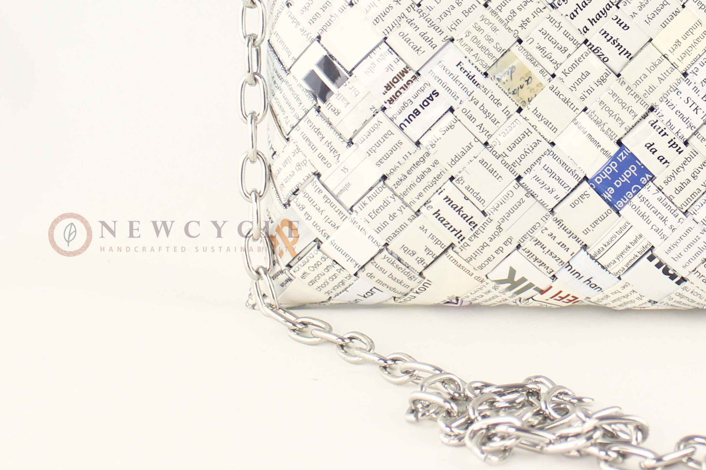 Close-up of newspaper-print hand-woven pattern on oversized bag