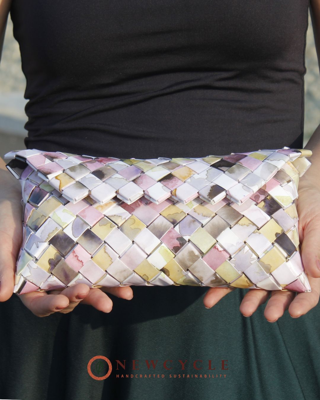 Pastel woven clutch styled in soft feminine setting