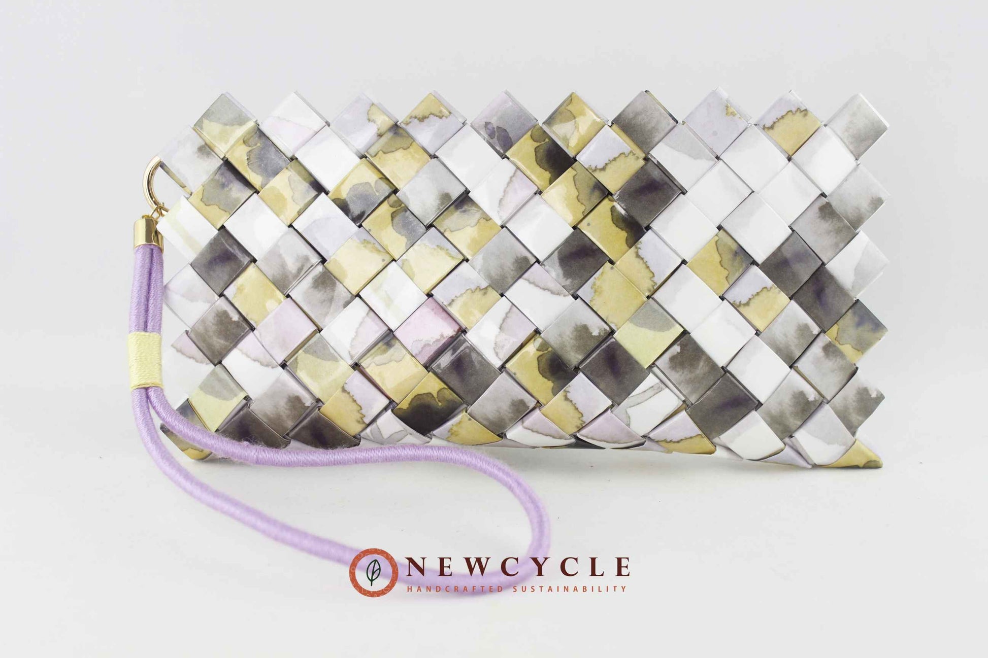 Pastel upcycled woven clutch with mosaic pattern and wristlet strap