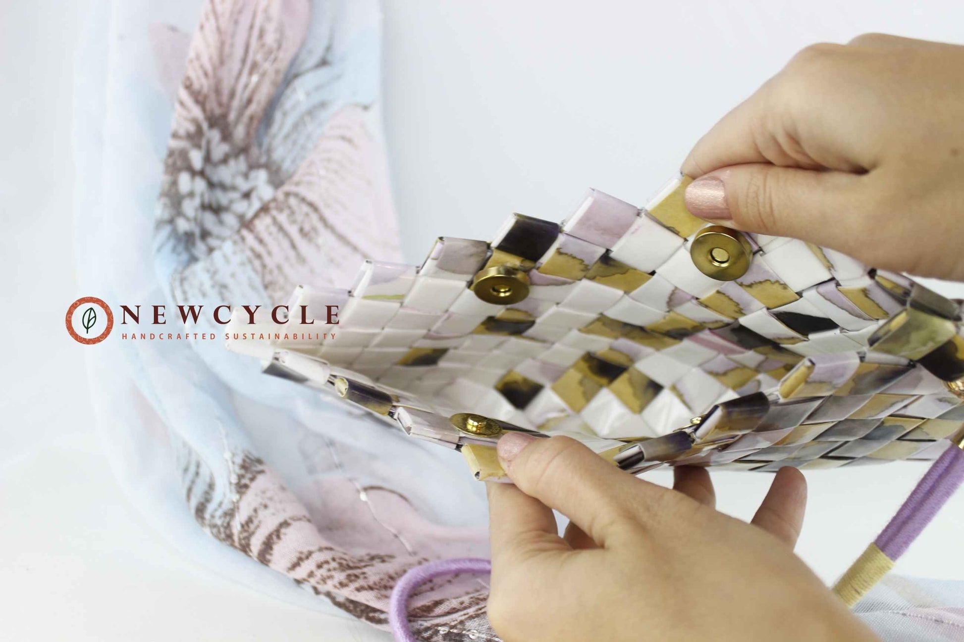 inside view of pastel mosaic woven clutch with wristlet strap