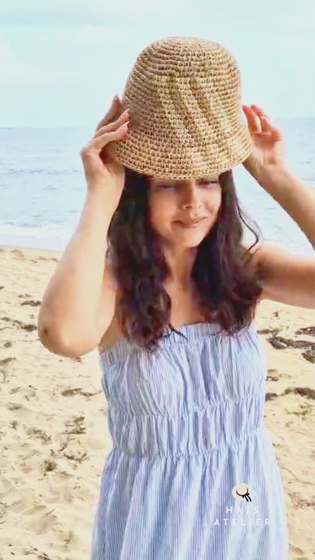 Crochet raffia bucket hat worn at the beach as a lightweight summer straw  video