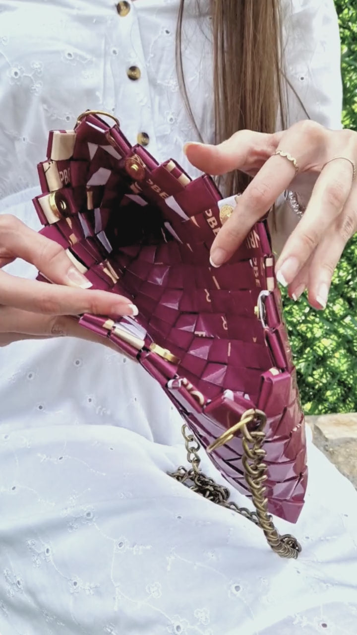 Video showing fuchsia handmade woven purse in close-up detail