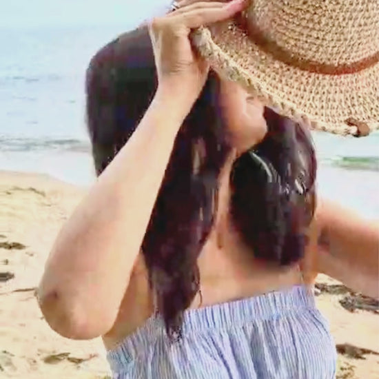 Boho crochet raffia summer hat with medium brim in motion