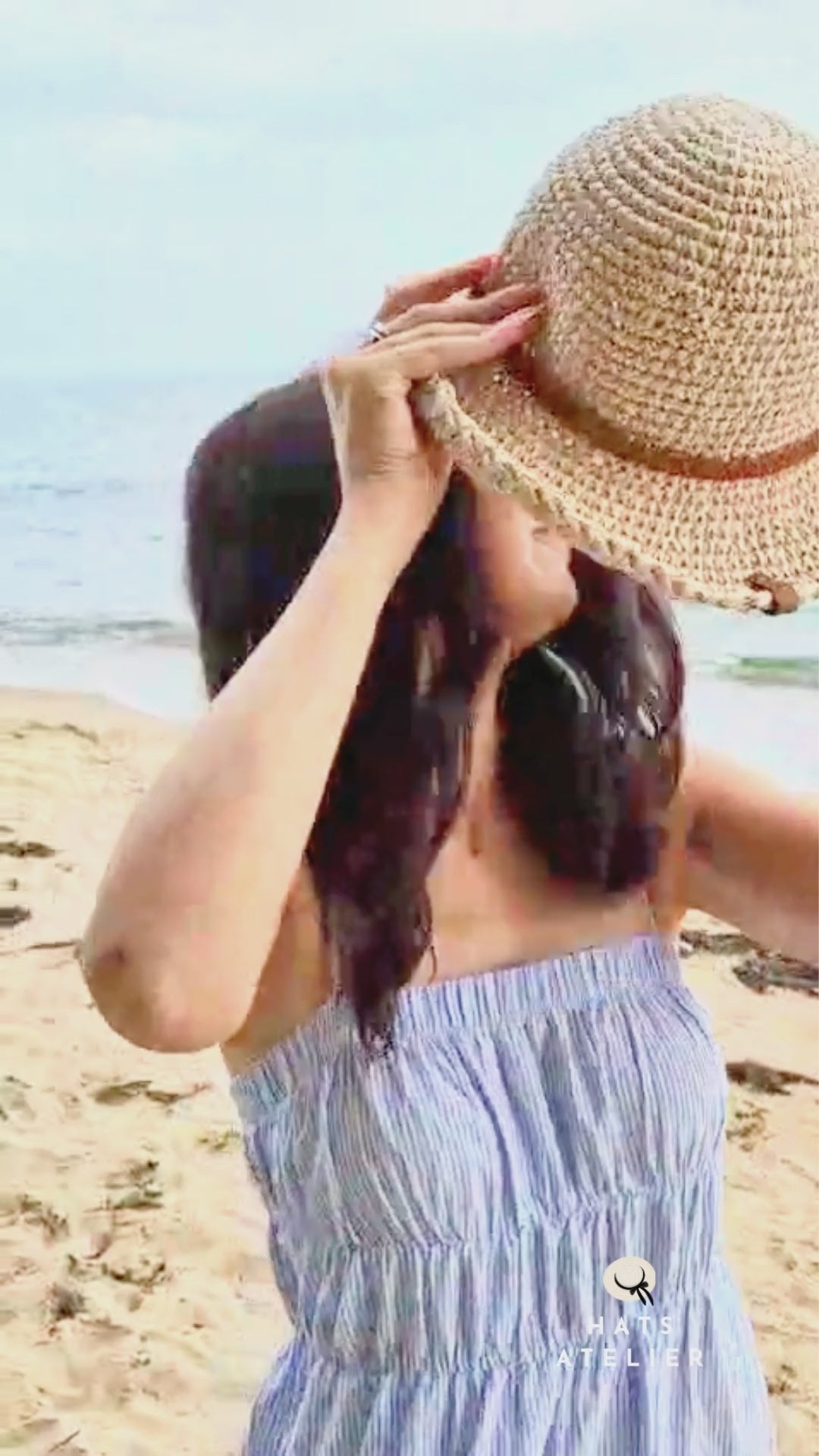 Boho crochet raffia summer hat with medium brim in motion