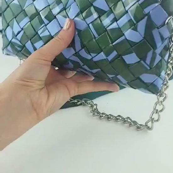 hand holding green lilac upcycled woven purse video