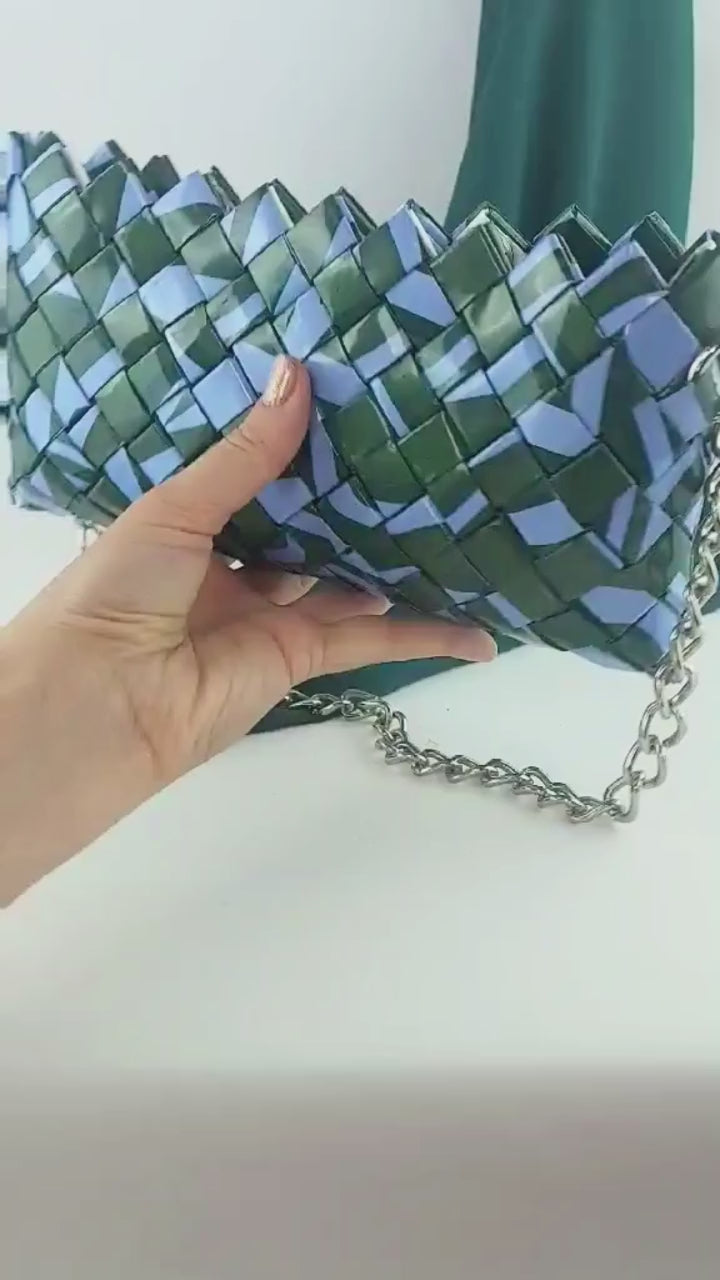hand holding green lilac upcycled woven purse video