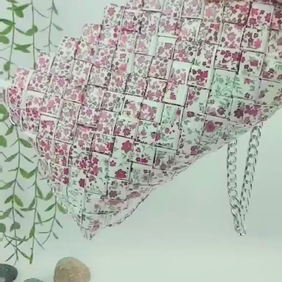 Video showing red floral woven purse with silver chain
