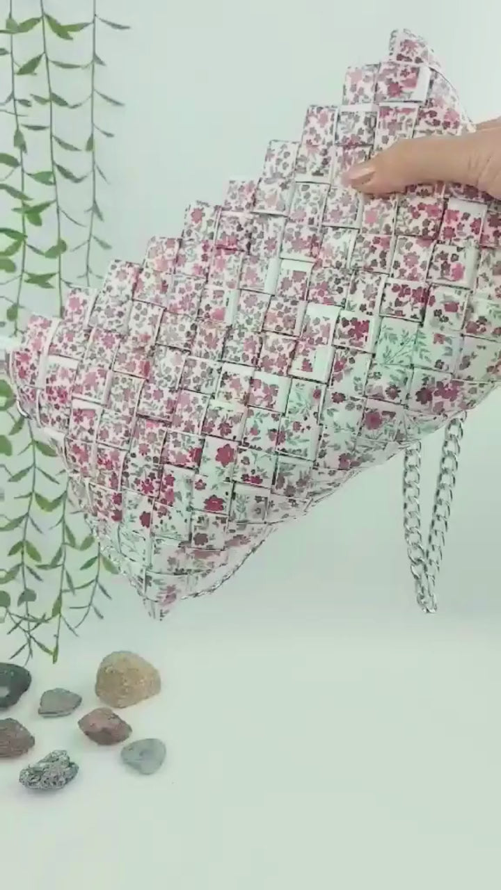 Video showing red floral woven purse with silver chain
