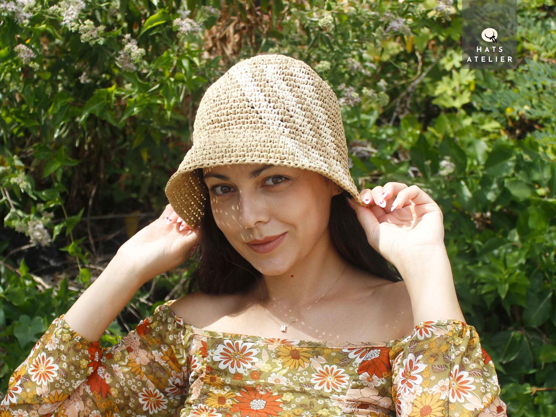 Handwoven crochet raffia bucket hat worn as a boho summer beach hat