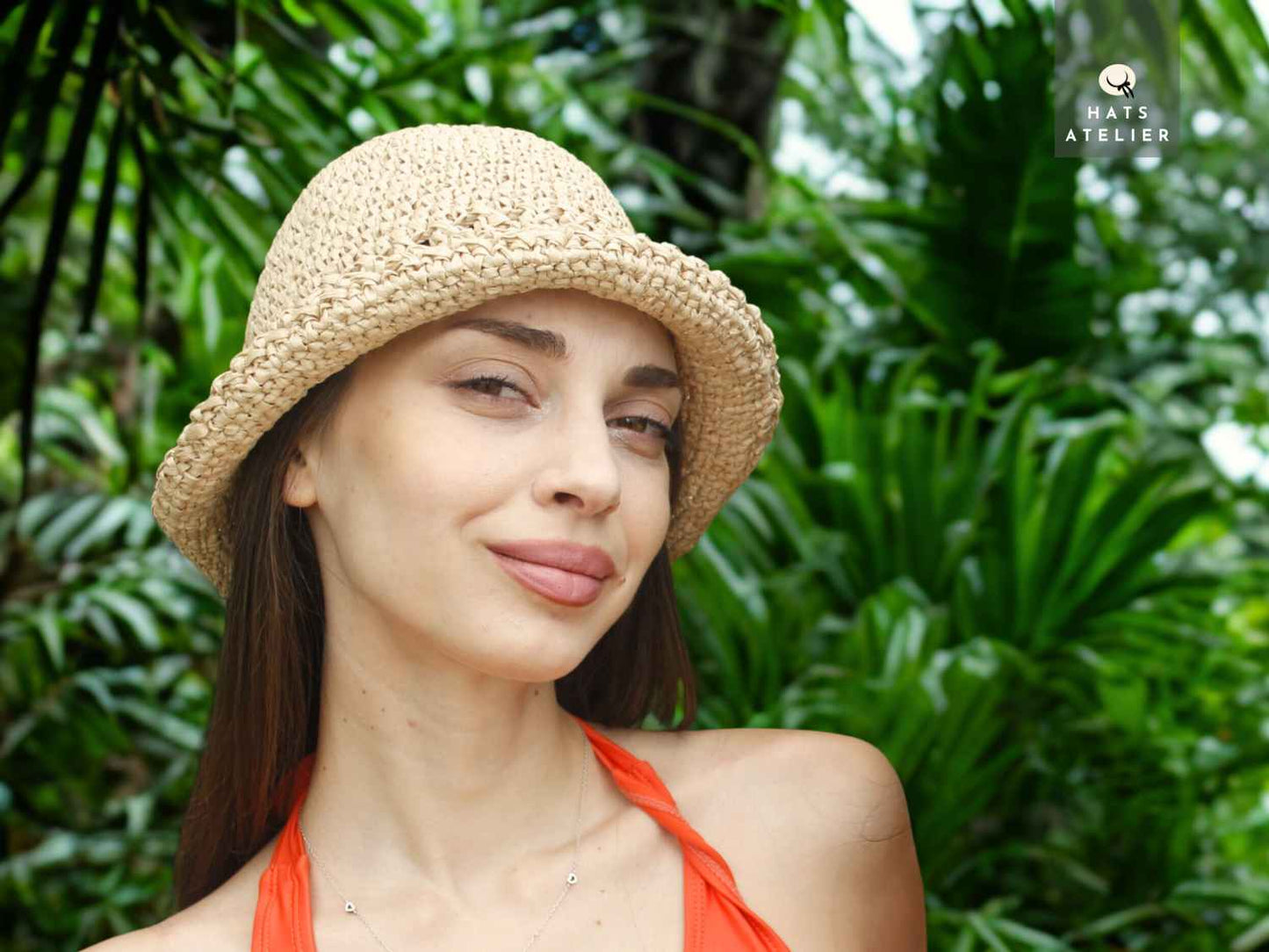 Handwoven crochet raffia bucket hat worn as a boho summer hat