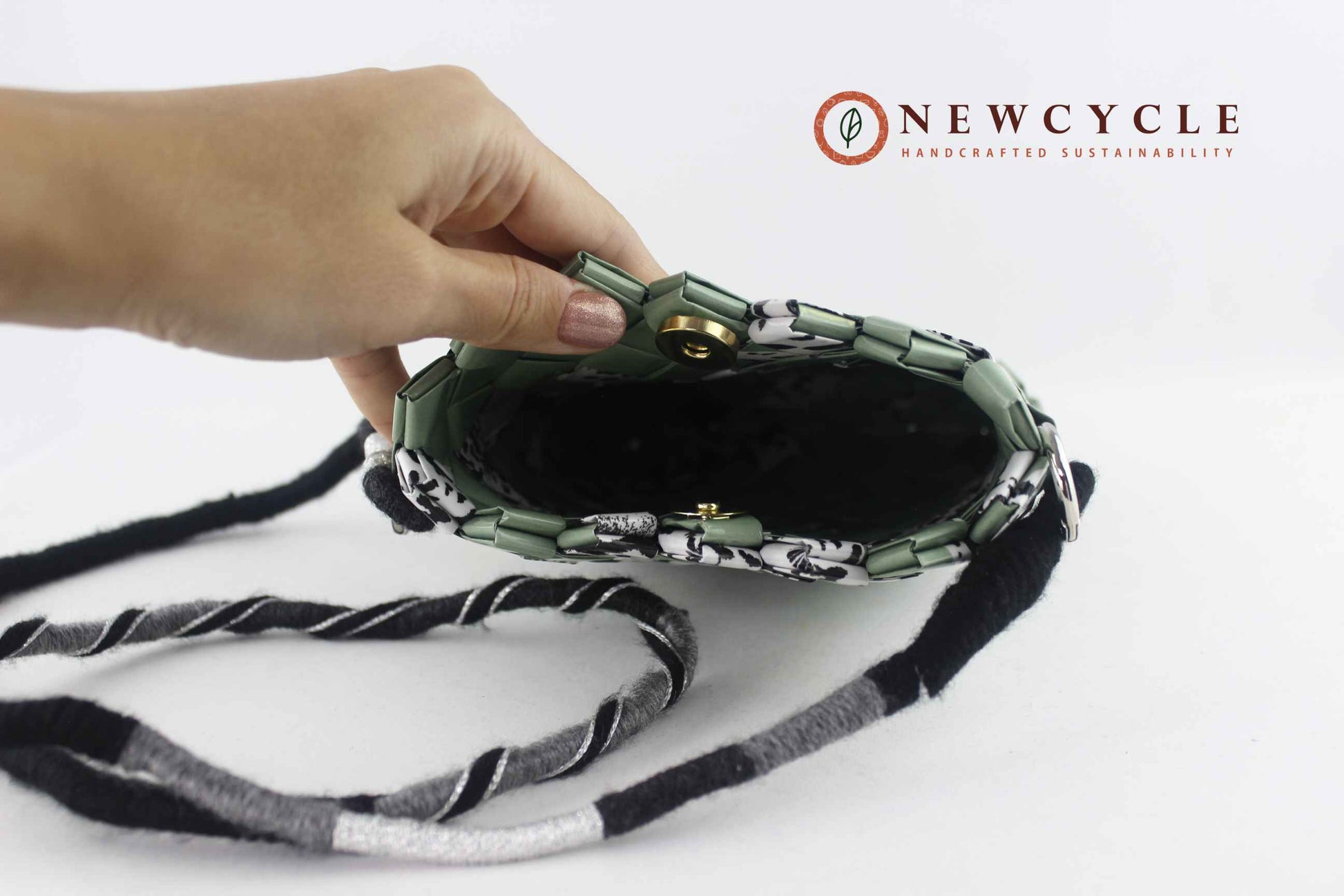 sage green animal print woven purse inside view