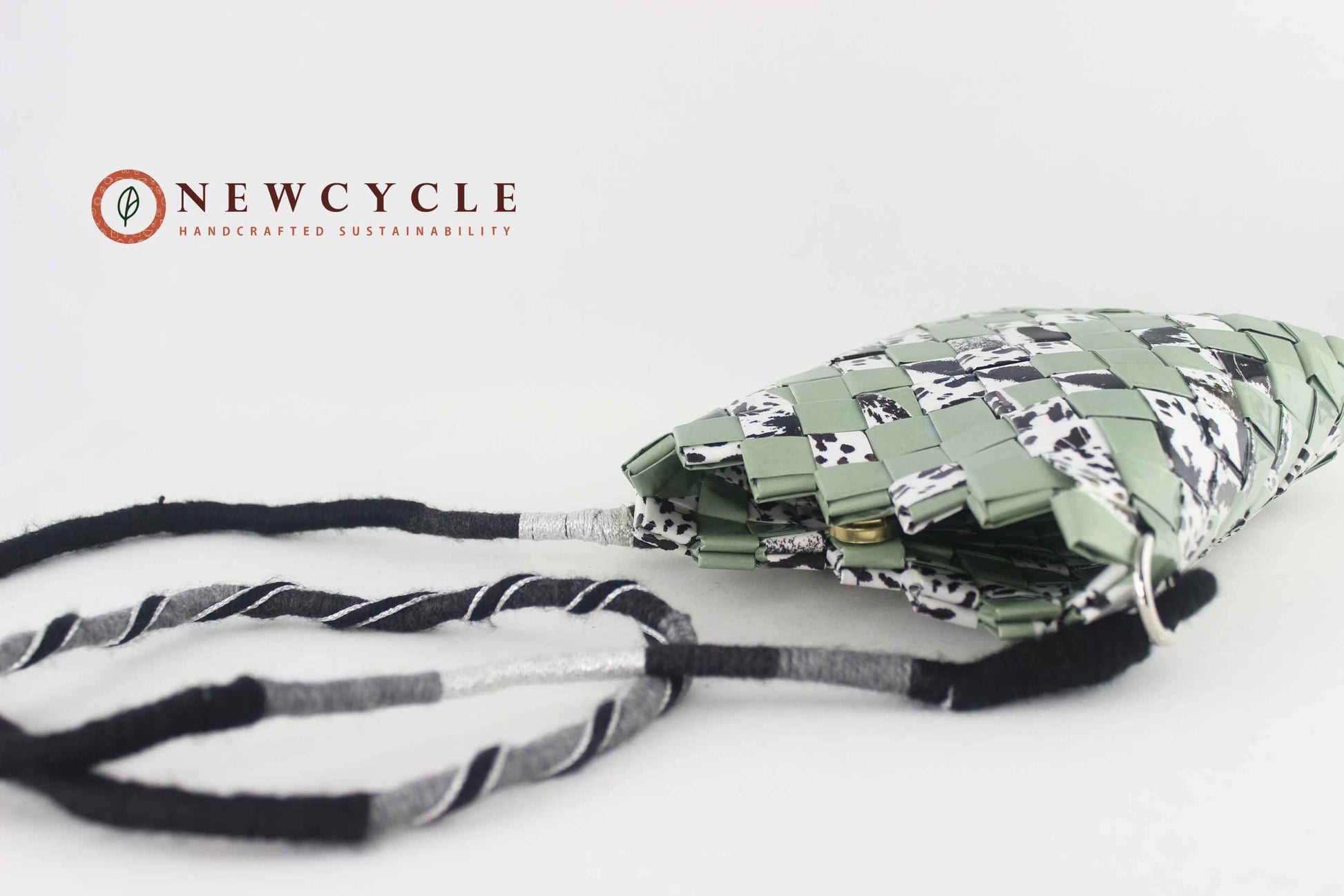 top view sage green animal print woven purse