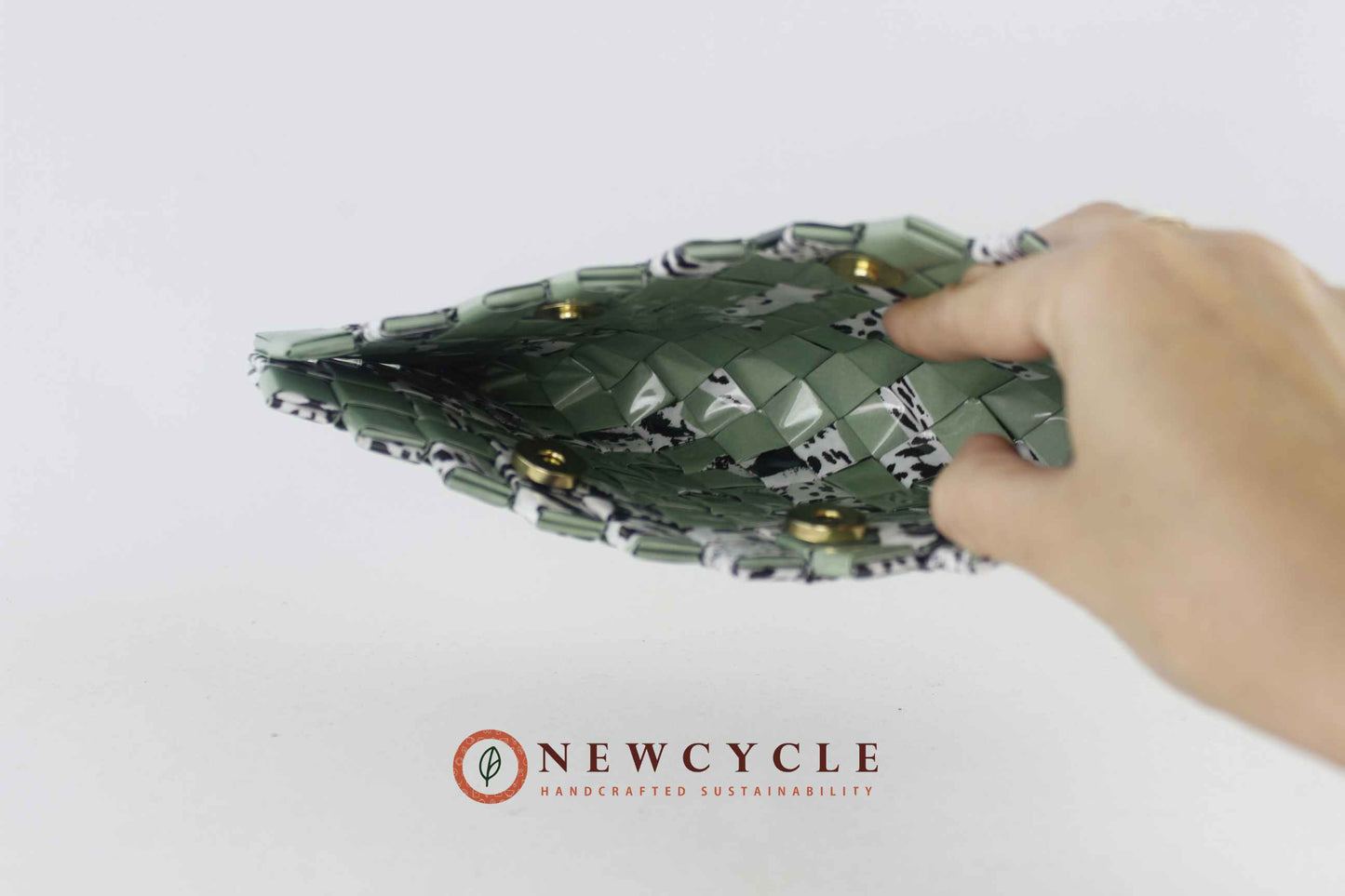 top view sage green woven clutch with mosaic animal print texture