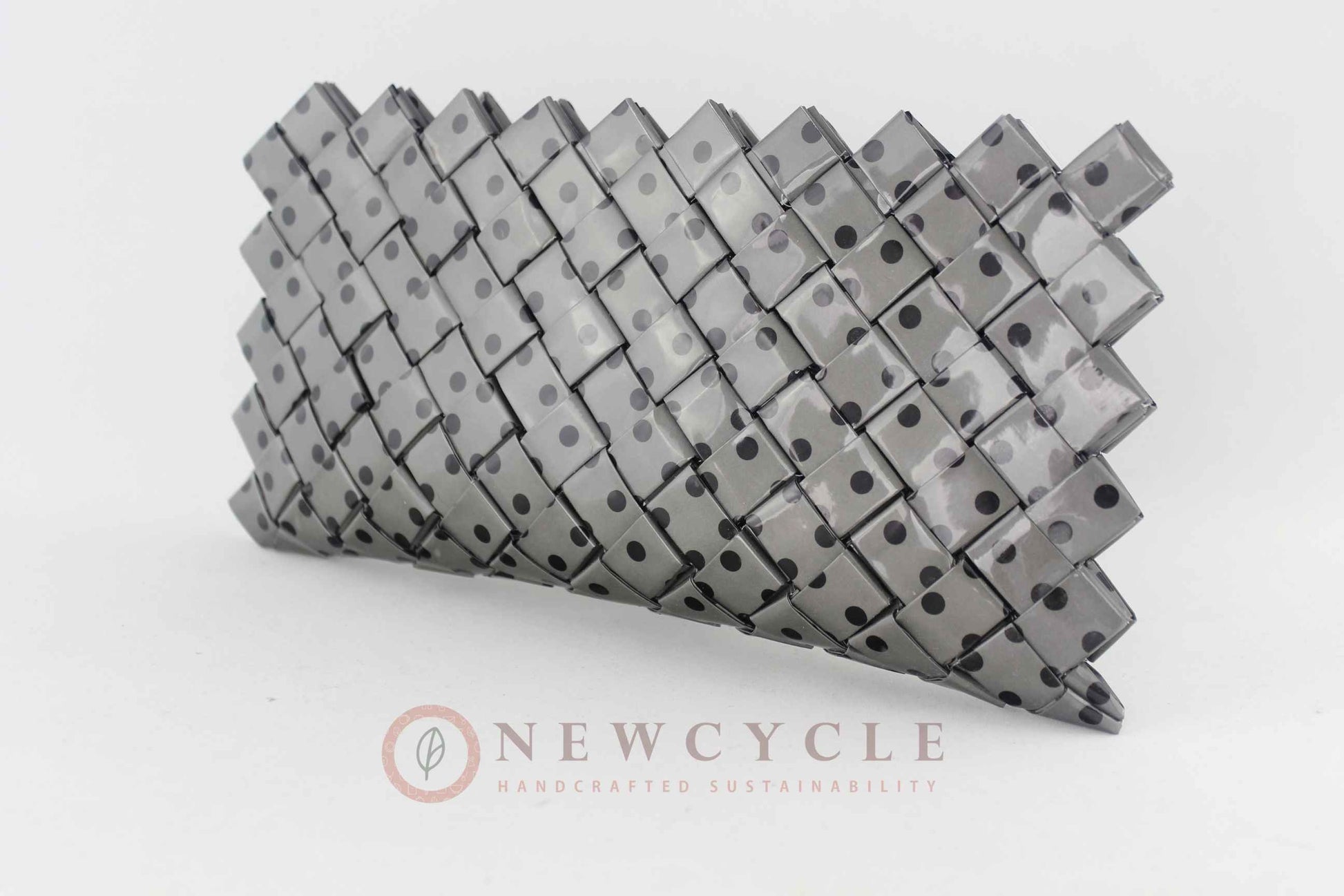 Upcycled black and grey woven clutch with glossy finish