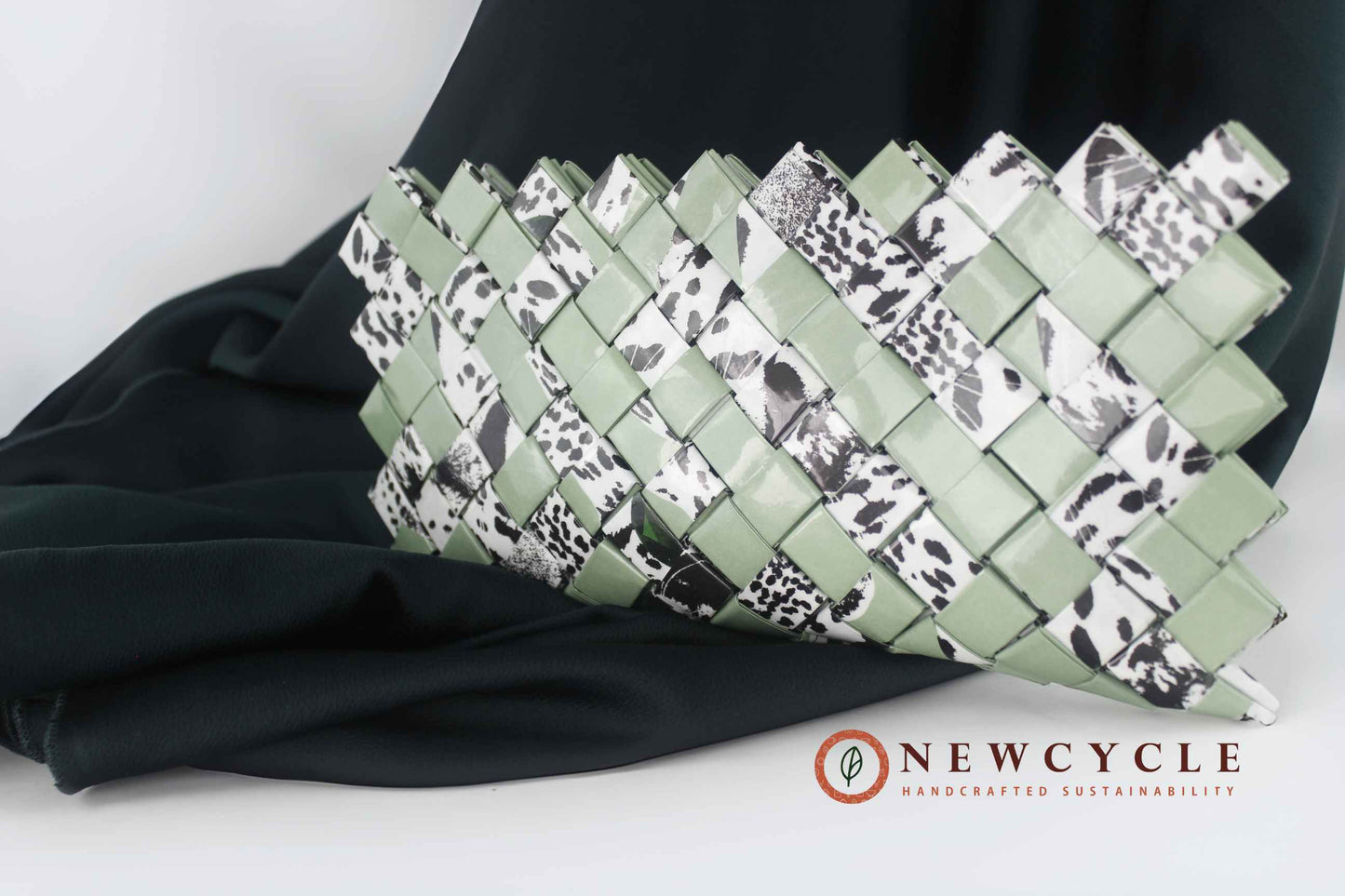 upcycled sage green clutch with animal print mosaic pattern